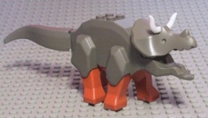 tricera03-10 Triceratops met donkeroranje benen en witte hoorns (PAKKETZENDING) donker, grijs (klassiek) NIEUW *