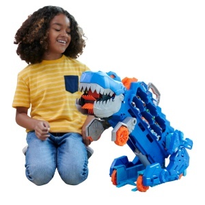 Transportor Hot Wheels City Ultimativ cu T-Rex, 2 masini incluse, pentru peste 20 de masini