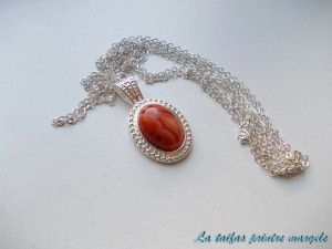 Striped red agate silver-plated oval pendant
