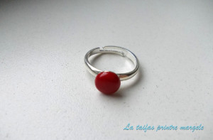 Adjustable sterling silver ring with red round coral