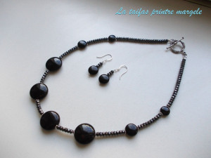 Necklace of small faceted hematite and onyx disks