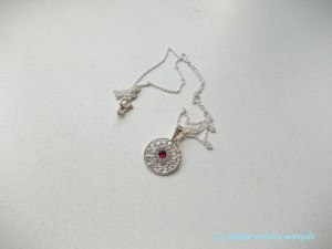Sterling silver floral disk with Swarovski rhinestone ruby