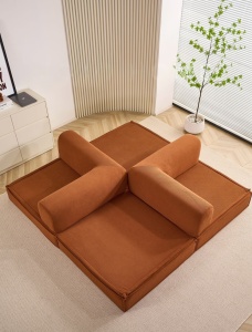 canapea modulara memory foam caramiziu asezata in forma de conversational pit
