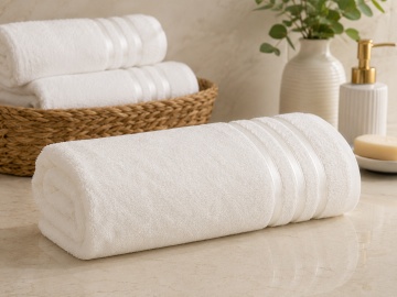 Prosop alb Hobby Home Dolce rulat, din microbumbac 100%, pe blat de baie elegant
