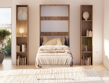 Pat rabatabil ADRK Vivario 90 – 90x200 cm – Stejar Artisan – închis în ambient luminos, vedere frontală între biblioteci
