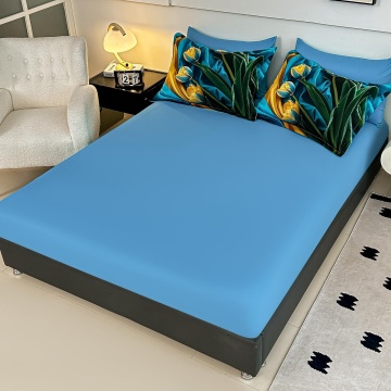 Cearceaf cu elastic bleu și fețe de pernă cu lalele galbene și frunze decorative