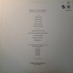 Paul Young ‎– албум Between Two Fires - Img 2