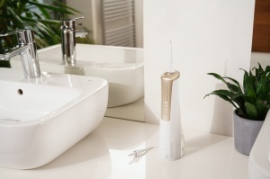 Irigator bucal ETA AquaCare Power 2708 90000, 3 moduri de curatare, rezervor 200 ml, IPX7, alb/auriu - Img 9