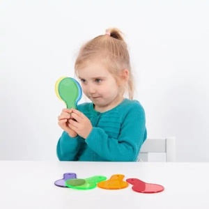 Set TickiT cu șase palete circulare transparente colorate în culori primare și secundare, concepute pentru explorarea luminii și amestecarea culorilor.