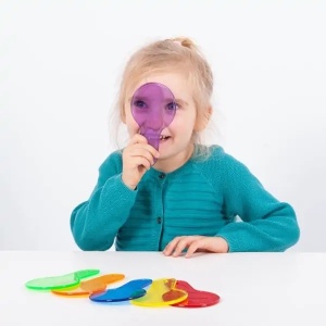Set TickiT cu șase palete circulare transparente colorate în culori primare și secundare, concepute pentru explorarea luminii și amestecarea culorilor.