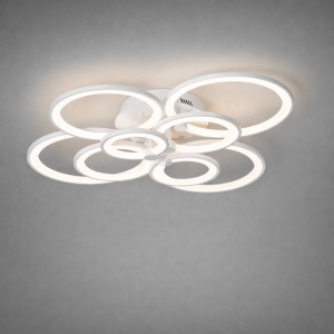 Lustră LED modernă cu cercuri suprapuse și lumină caldă, având un design fluid și elegant