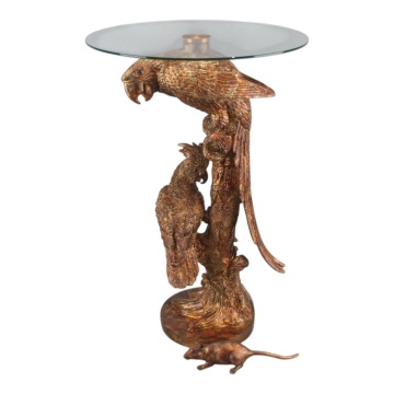 Măsuță laterală sculptată rotundă, auriu, cu bază în formă de papagali pe trunchi și blat din sticlă, finisaj antichizat, 62 x 40 cm, „Cacatoès”