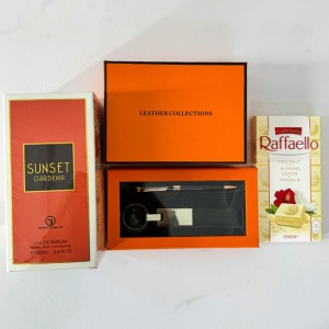Pachet Orange cu portofel din piele naturala, set breloc si pix asortat, parfum Sunset Gardenia 100ml si 1 ciocolata Raffaelo