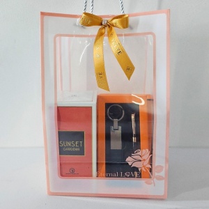 Pachet Orange cu portofel din piele naturala, set breloc si pix asortat, parfum Sunset Gardenia 100ml si 1 ciocolata Raffaelo