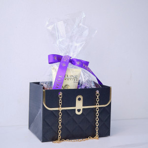 Pachet cadou Tenderness, cu brosa martisor fluture, crema pentru maini Eveline Royal Snail, ciocolata Ritter Sport Cacao Mousse si cutie metalica cu trandafiri de sapun si ursulet plus, in punga eleganta tip poseta, Albastru indigo - Img 8