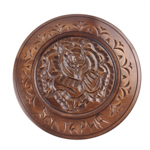 Decorative carved wooden plate in walnut color