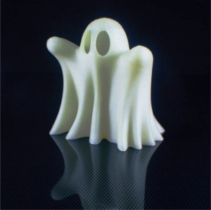 Fluorescent white ghost statuette