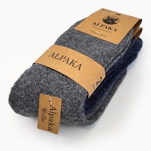 Prezentare pachet șosete groase Alpaca Peak Midnight cu etichetă, ce arată stratul dens din lână de alpaca.