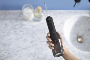 Irigator bucal PHILIPS Sonicare Cordless Power Flosser 3000 HX3826/33, Tehnologie QuadStream, Portabil, 2 moduri de curatare, 3 niveluri de intensitate, 2 x capete de curatare si 1 x husa transport, Negru, L x A x I (mm) 92x134x247 - Img 3