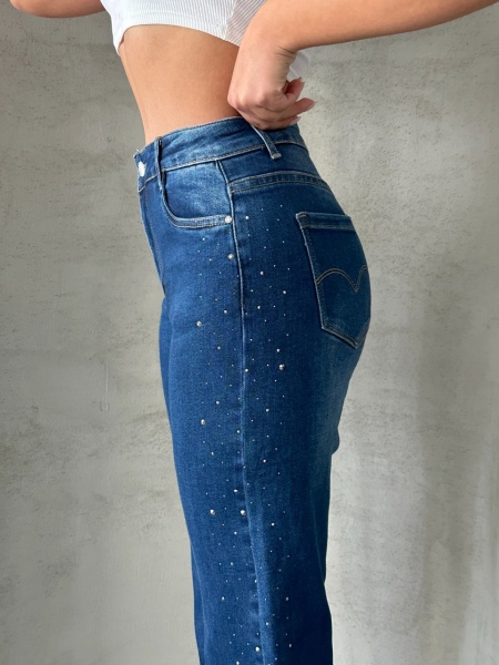 Blugi evazati elastici cu strasuri pe lateral