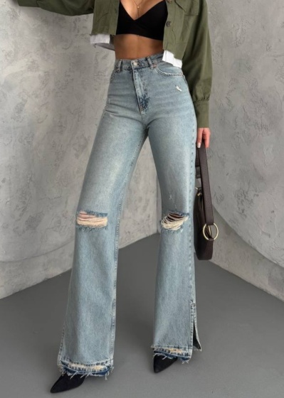 Blugi evazati cu rupturi si tiv nefinisat