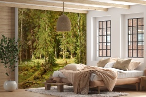 Fototapet pădure cu brazi în dormitor rustic cu pat din lemn natural, lenjerie bej-portocaliu și tavan cu grinzi aparente