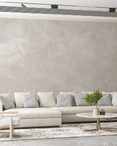 Living spațios cu canapea modulară bej, decorat cu fototapet texturat în nuanțe naturale, tapet personalizat cu efect de piatră