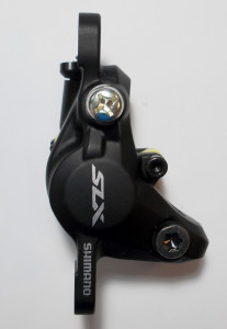 ETRIER FRANA PE DISC SHIMANO SLX BR-M7000 HIDRAULIC FATA SAU SPATE FARA ADAPTOR PLACUTE METAL J04C CU ARIPIOARE DE RACIRE AMBALAT IND.