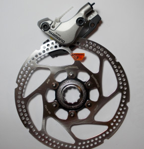 ETRIER FRANA PE DISC SHIMANO DEORE LX BR-M585 FATA HIDRAULICA PT. POST MOUNT INCL. ADAPTOR PT. STANDARD (RING) PLACUTE RESIN INCL. ROTOR SM-RT62 SURUBURI DE FIXARE 24.5MM AMBALAT IND.