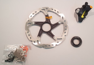ETRIER FRANA PE DISC SHIMANO XTR BR-M975 FATA PT. STANDARD PLACUTE RESIN & METAL ROTOR SM-RT97S AMBALAT IND.