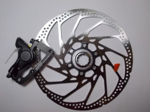 ETRIER FRANA PE DISC & ROTOR SHIMANO HONE BR-M601 FATA INCL. SM-MA-F203P/S (WIRE) PT. FURCA STANDARD PLACUTE METAL ROTOR SM-RT62L AMBALAT IND.