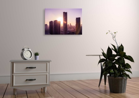 Tablou Canvas peisaje apus de soare printre cladiri