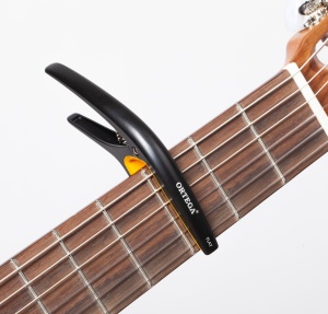 Ortega TWINcapo Satin Black Capodastru Universal
